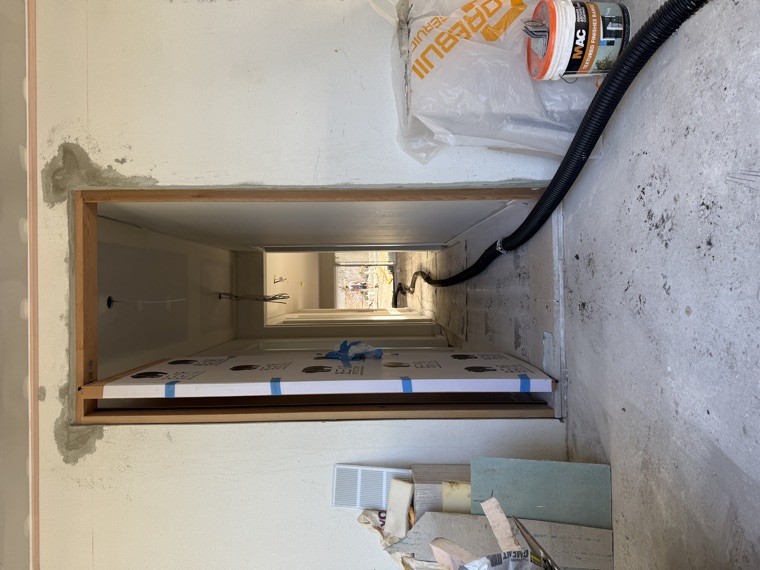 Vac hose through construction opening wall penetration Sydney