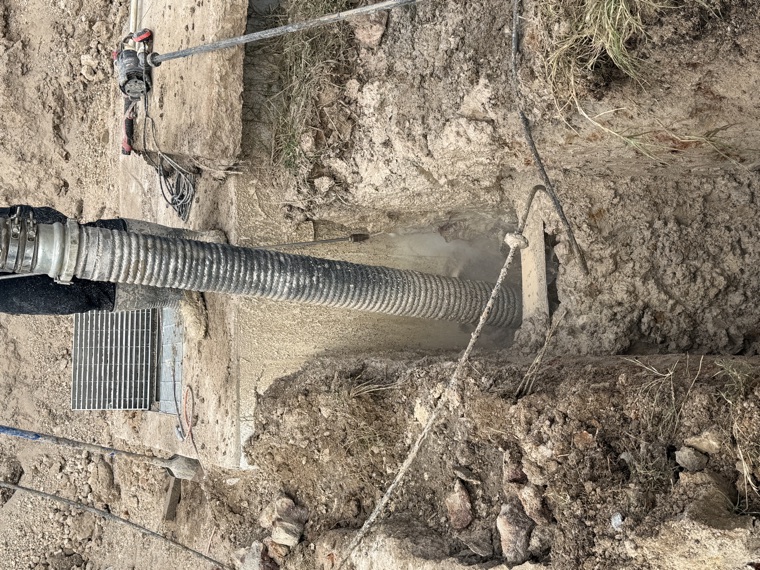 Hydro vac suction extracting spoil from utility potholing dig Sydney