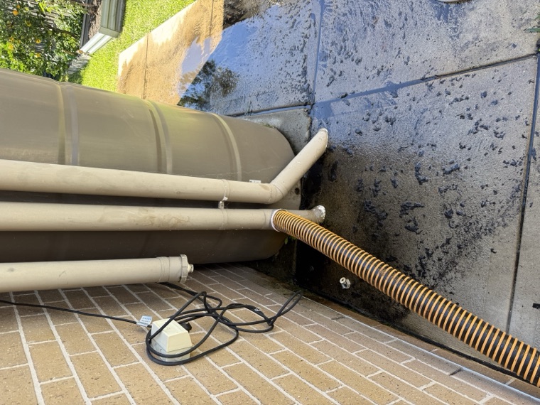 Blocked downpipe clearing with vac truck suction hose Sydney